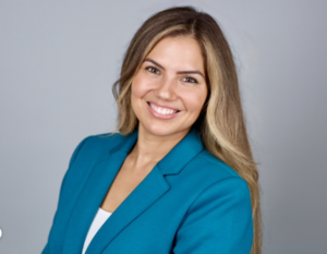 Headshot of Melanie Z. Plasencia in a blue blazer
